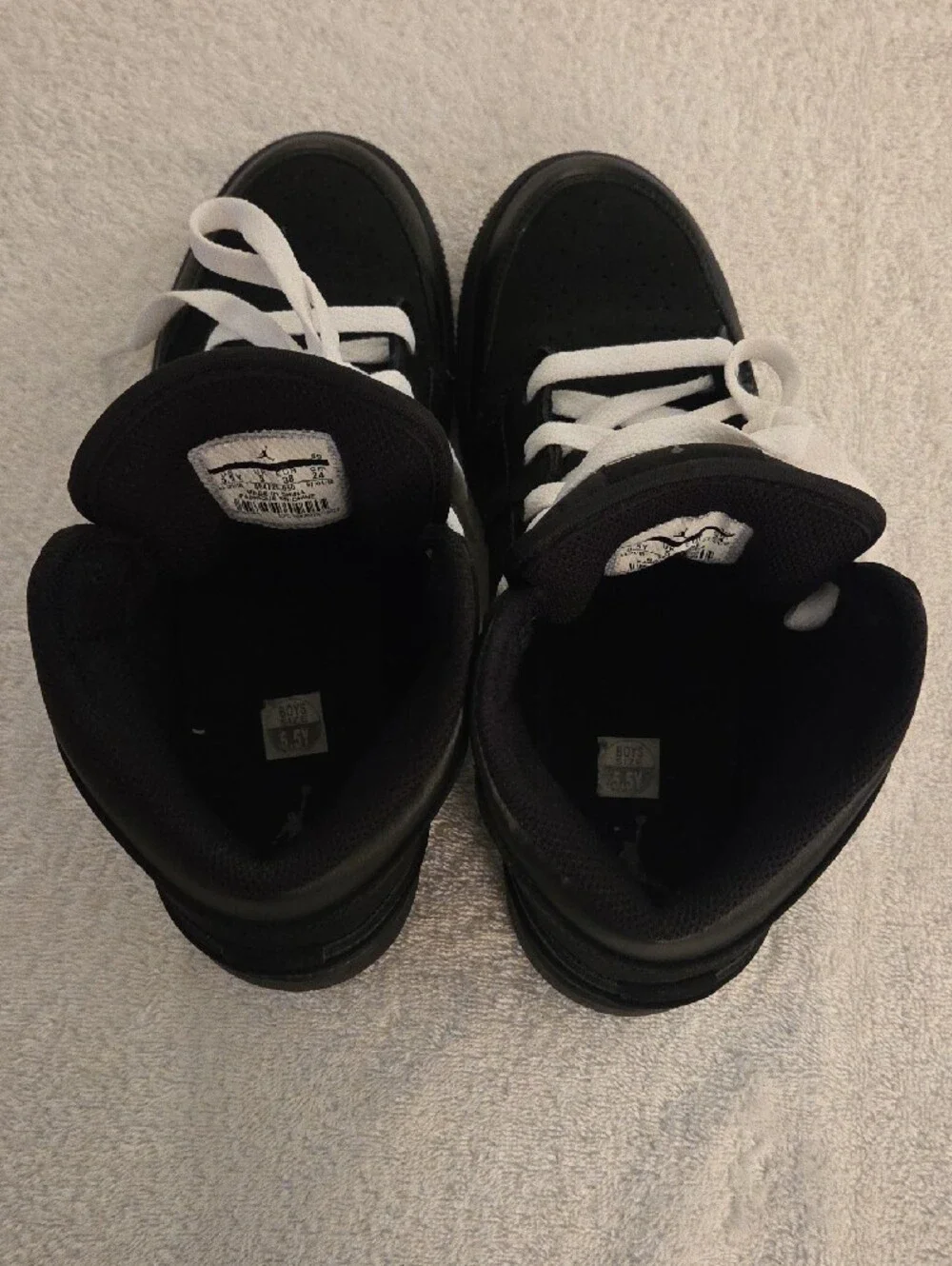 Jordan Kids Black and White High-Top Sneakers